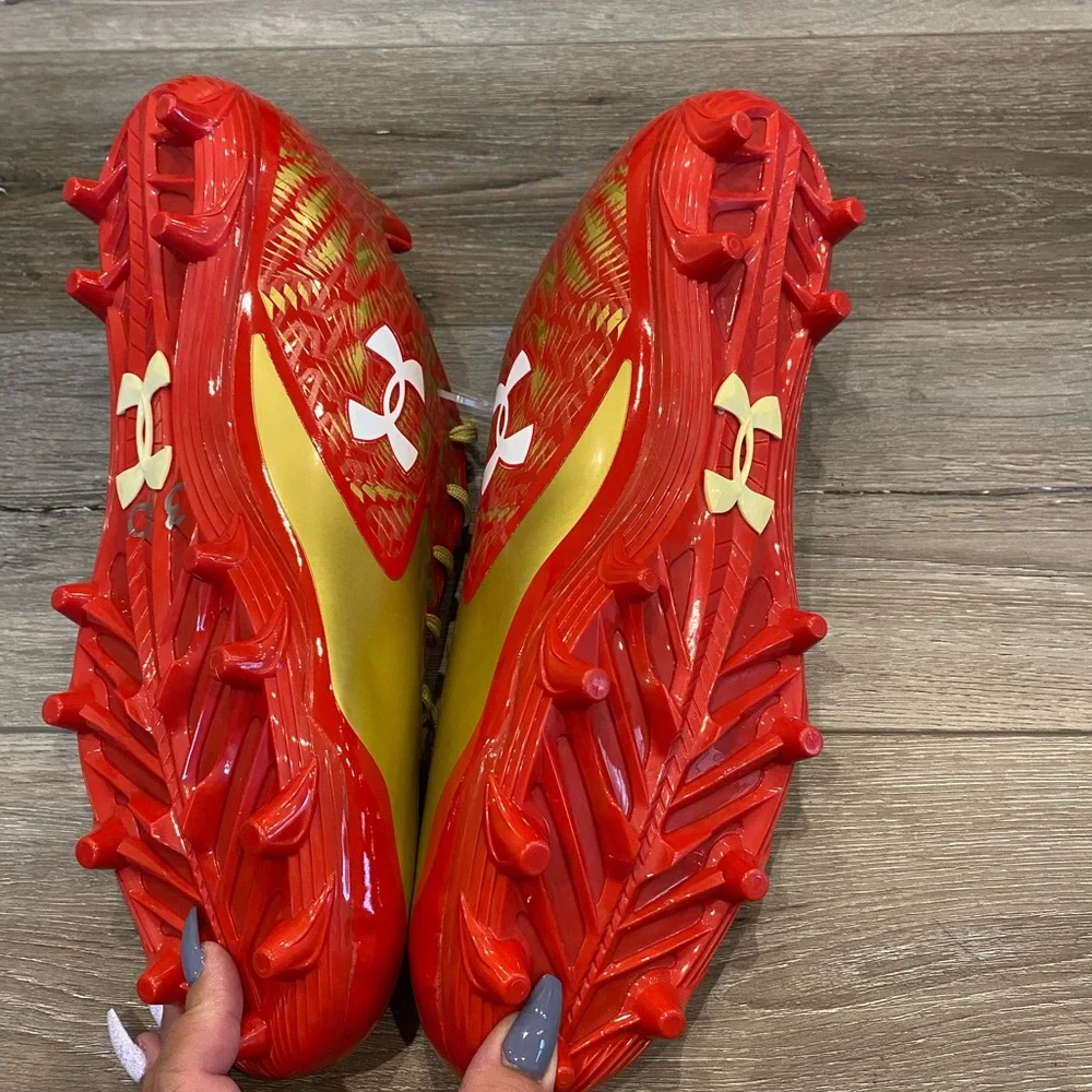 Under Armor red and gold football cleats NWOB